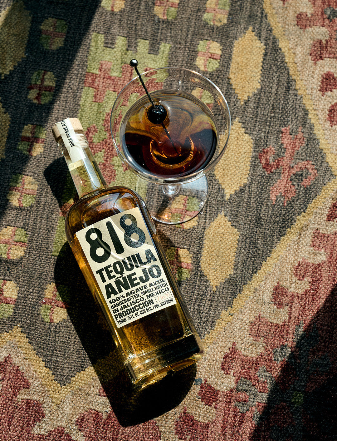 818 Añejo bottle with a manhattan cocktail