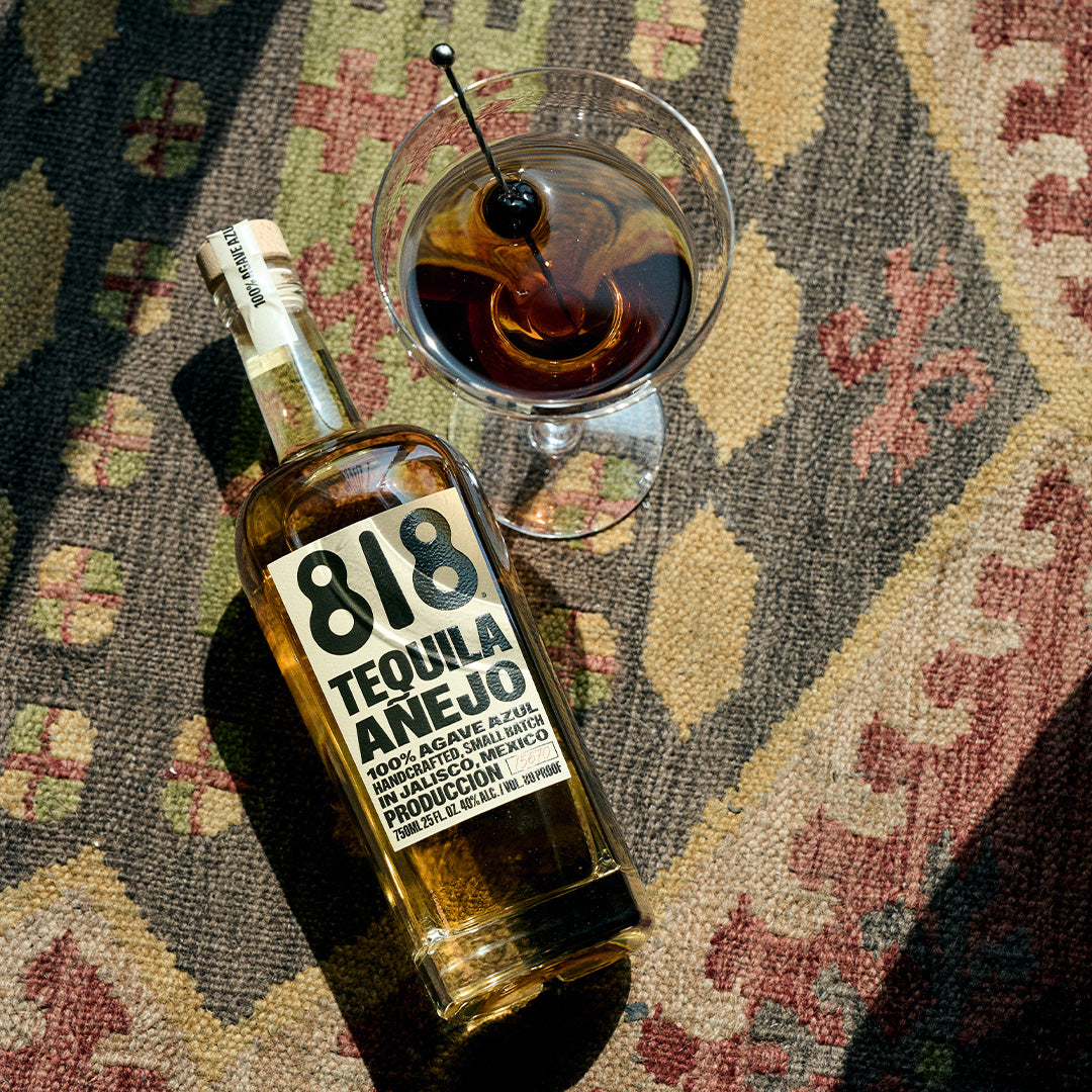 818 Añejo bottle with a manhattan cocktail